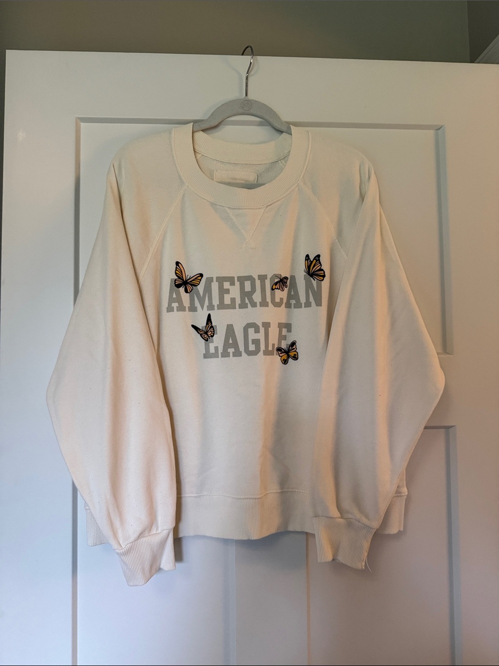 American Eagle Outfitters Cream Crewneck Sweatshirt with Butterfly Accents